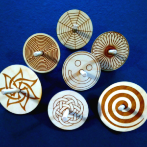 Laser engraved spin Tops
